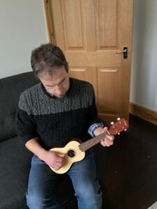 A photo of me playing the ukulele